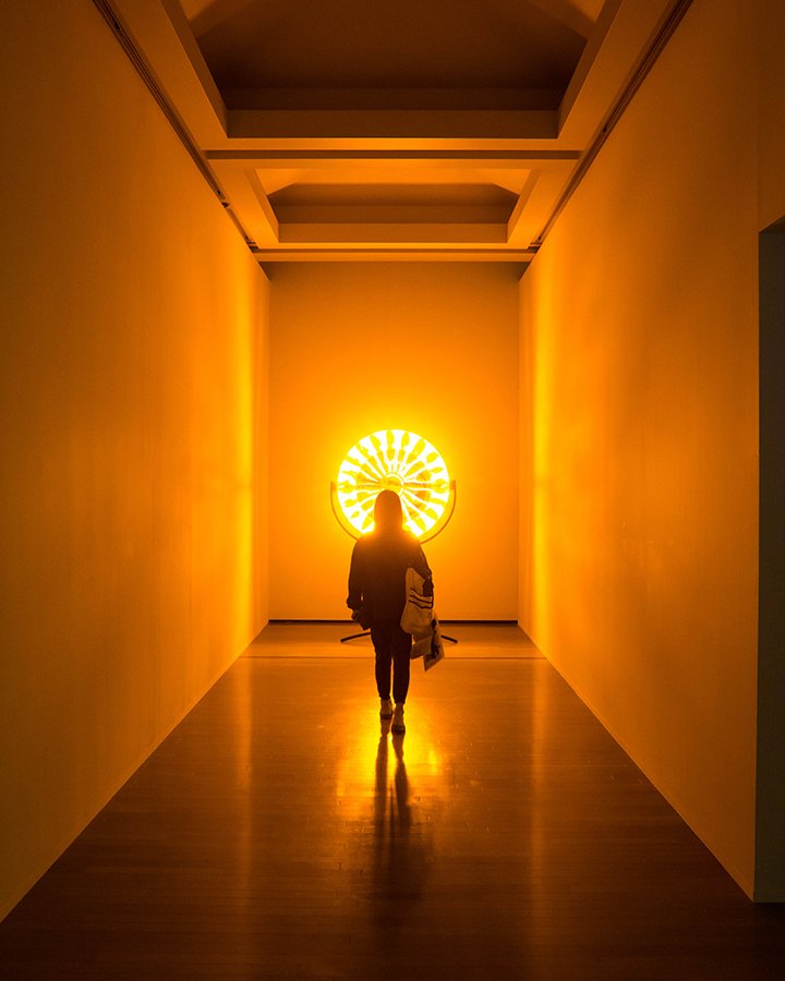 woman walking towards light