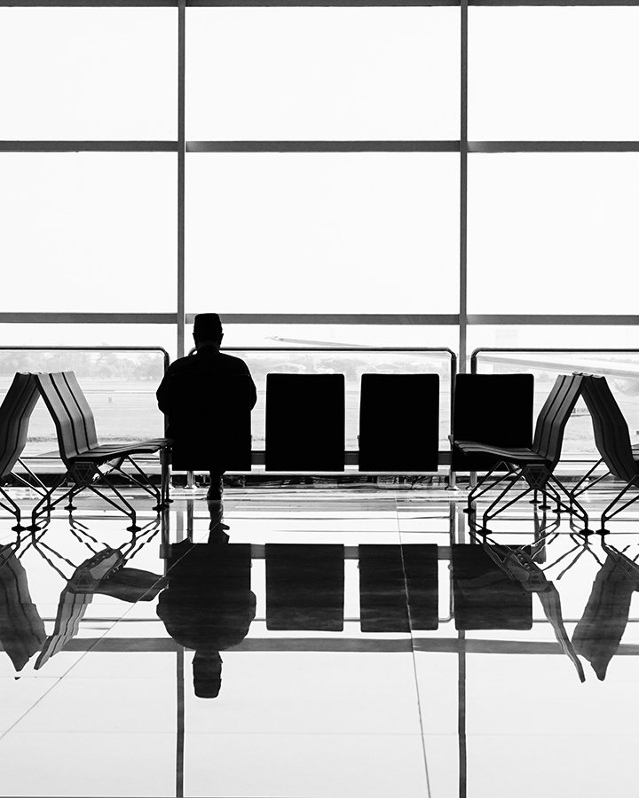 man waiting at airport