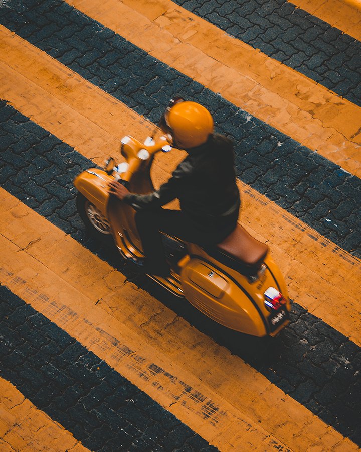 man on yellow bike