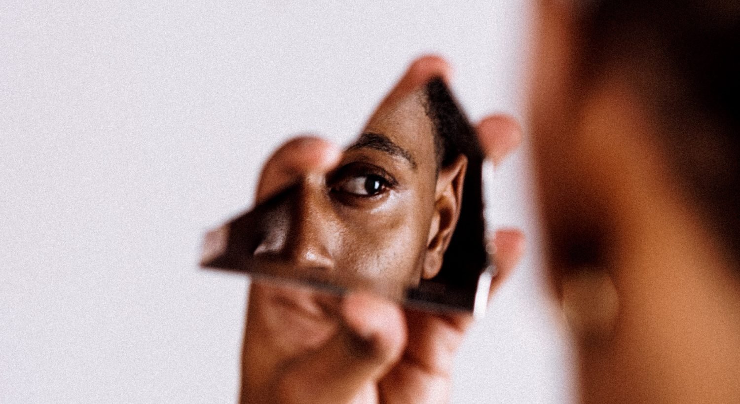 face in a broken mirror